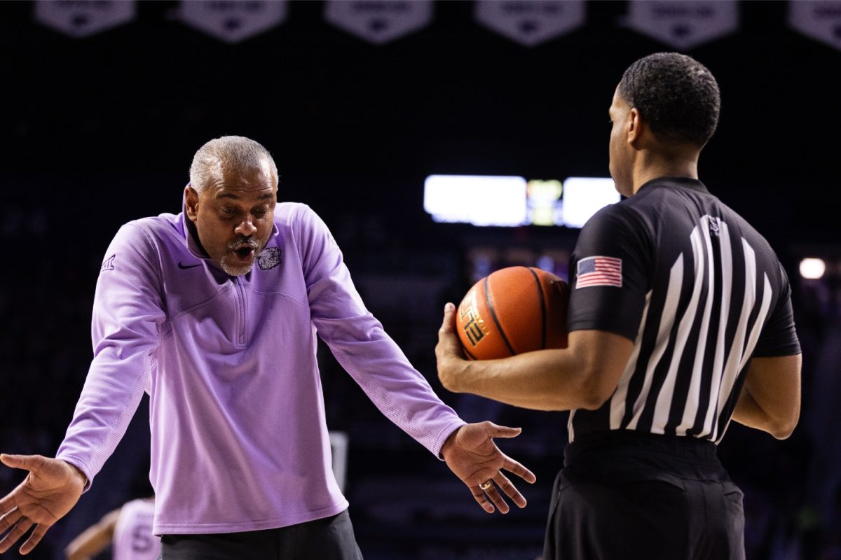 Head coach Jerome Tang argues with an official in the game against Oklahoma State as the Wildcats win 70-66. Tang received a technical foul in the next game against Iowa State after complaining about a call.