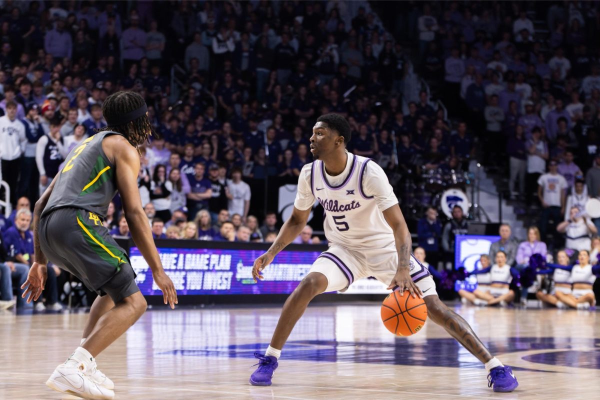 Guard Cam Carter dribbles between his legs against the Baylor Bears. The Wildcats upset the Bears 68-64 on Jan. 16.