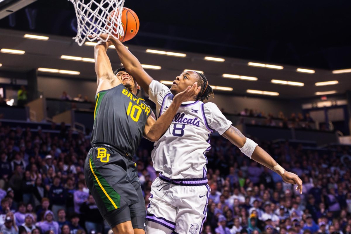 Freshman guard R.J. Jones blocks a Baylor dunk. The Wildcats beat the Bears 68-64 in overtime on Jan 16 at Bramlage Coliseum. 