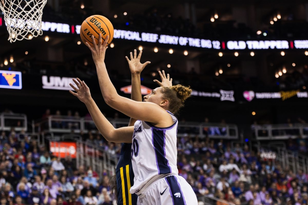 Center Ayoka Lee goes for a layup against West Virginia in the Big 12 tournament quarterfinals. In the 65-62 Wildcat victory, Lee grabbed a double-double with 22 points and 11 rebounds.