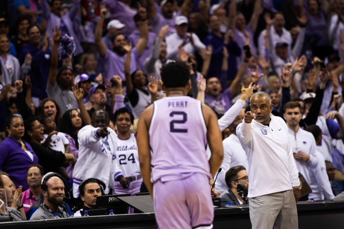 All the way from downtown, guard Tylor Perry impresses head coach Jerome Tang as he sinks a deep 3 to reclaim the lead against Texas with 12:34 left in the second half. K-State held the lead over Texas for all but 28 seconds through the rest of the game, besting the Longhorns 78-74 in the second round of the Big 12 tournament.