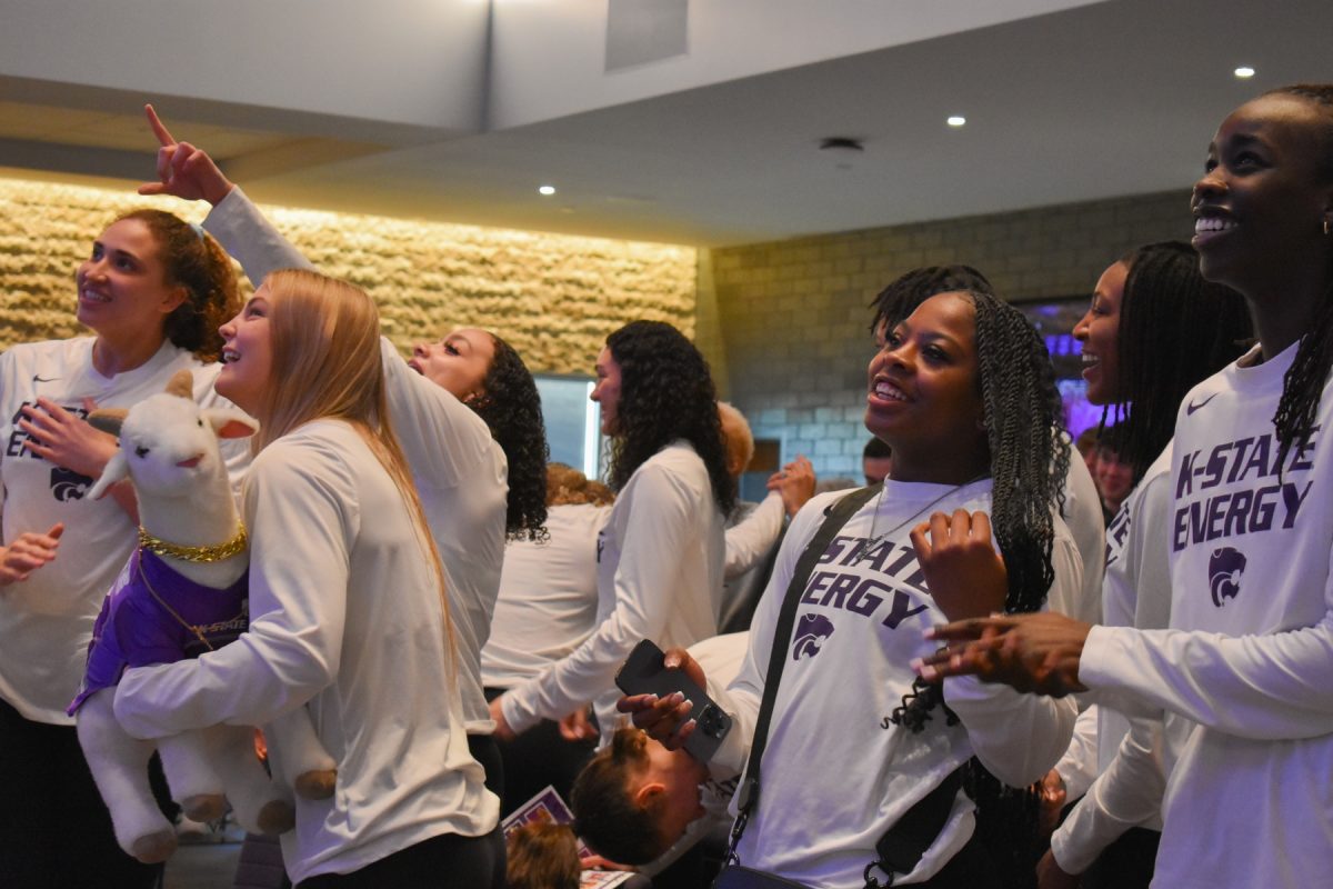 The women's basketball team celebrates after hearing their name called as the No. 4 seed in March Madness. This allows Manhattan to host the first two rounds of the tournament and gives K-State home court.