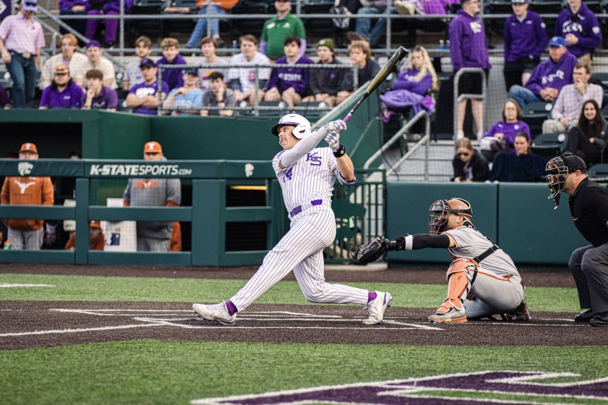 Infielder David Bishop swings for the pitch and hits a home run against Texas March 28. In Friday's match against Oklahoma State, Bishop secured the walk-off in extra innings for a Wildcat win.