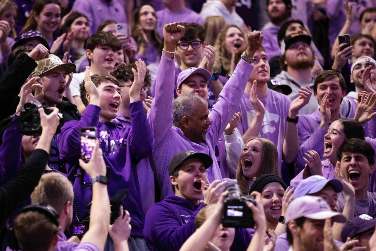 Head coach Jerome Tang celebrates in the student section after the Jan. 20 game against Oklahoma State University. Arkansas transfer Baye Fall committed to Tang and his staff April 27.