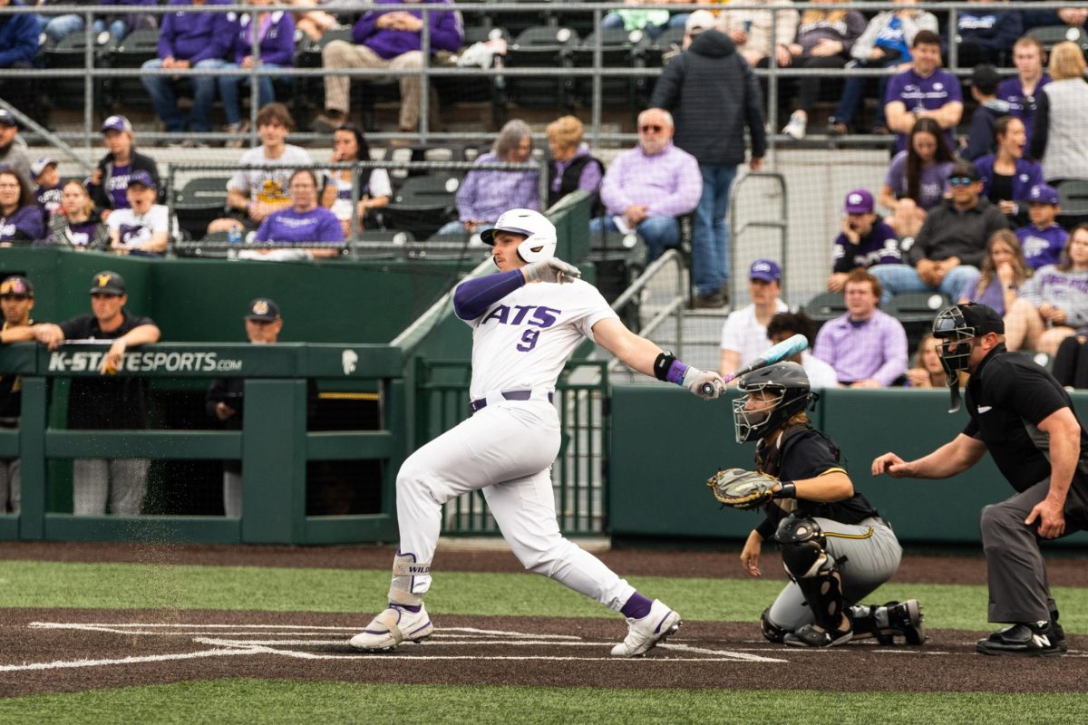 Outfielder Chuck Ingram looks at the ball after hitting it against his former team Wichita State. K-State won 6-3 as Ingram collected one hit in the Wildcats' second win over Wichita State on the season. 