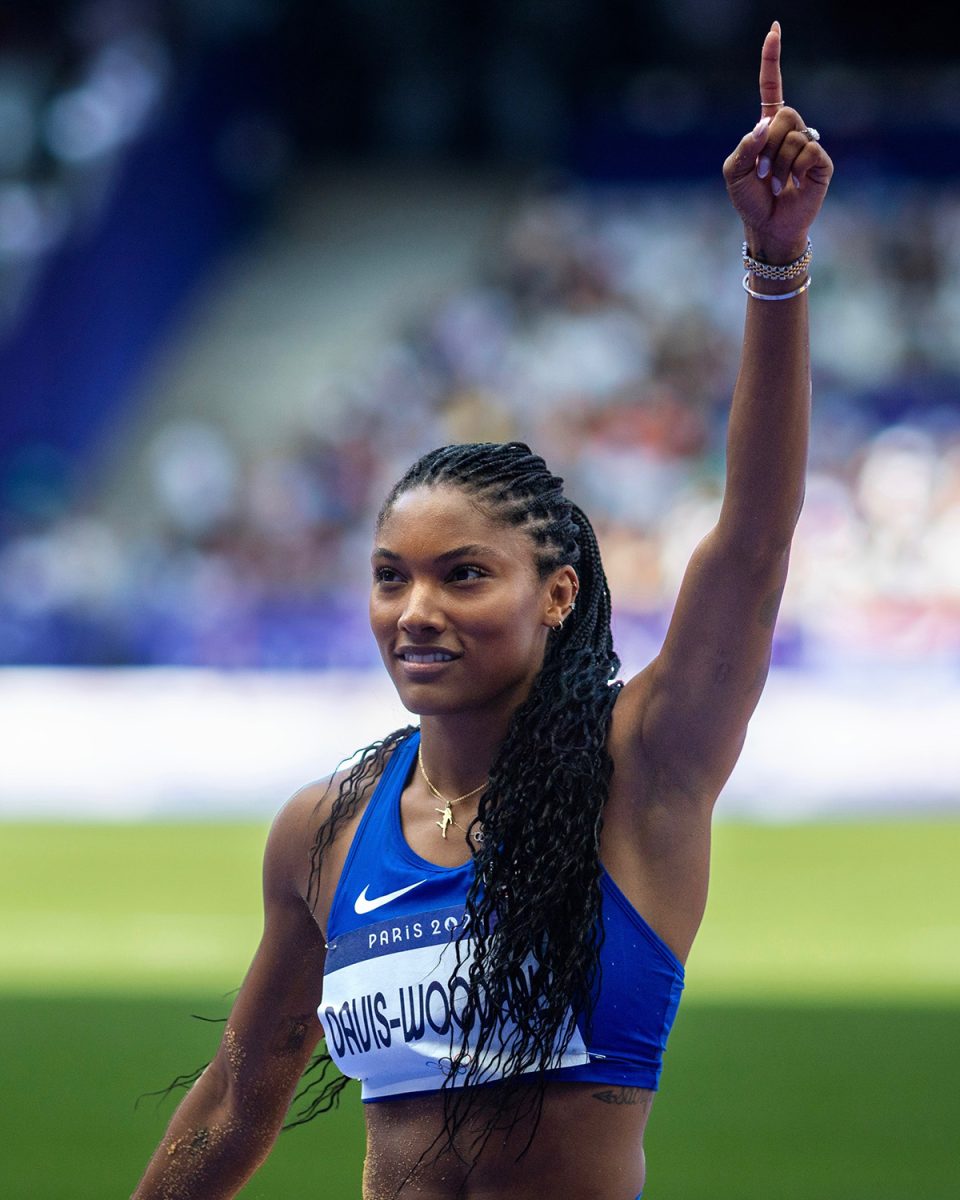 New track and field coach Tara Davis-Woodhall points up in celebration after her competition. (Photo Courtesy of U.S. Track and Field)