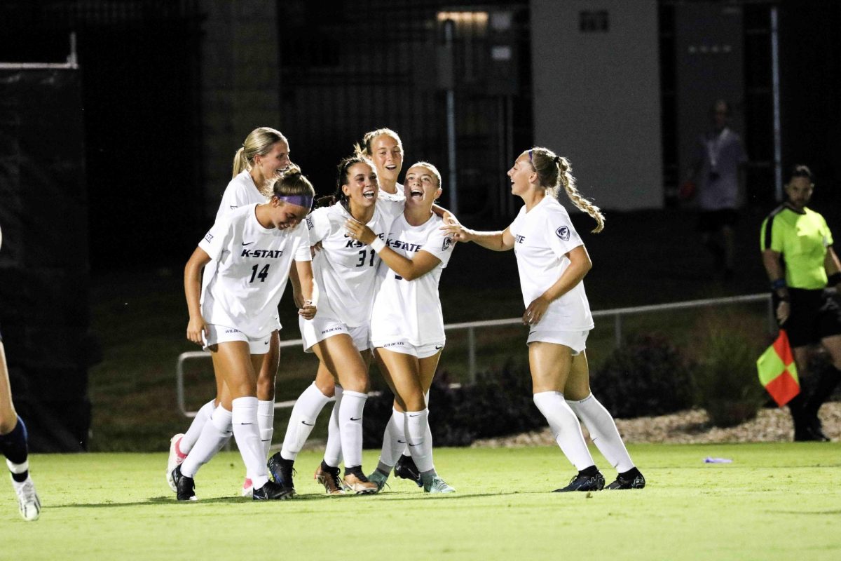 After a goal, then-freshman Morgan Struttmann celebrates with teammates Sophie Harlan (right) and Reece Walrod (left) against UTSA on August 24, 2023. 