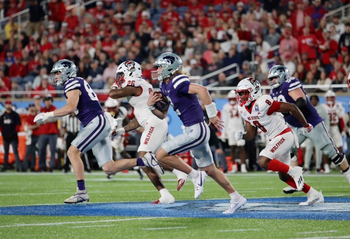 Quarterback Avery Johnson displays his speed during the Pop-Tarts Bowl. The Wildcats won the bowl game Dec 28, 2023 with a final score of 28-19 against North Carolina State. 