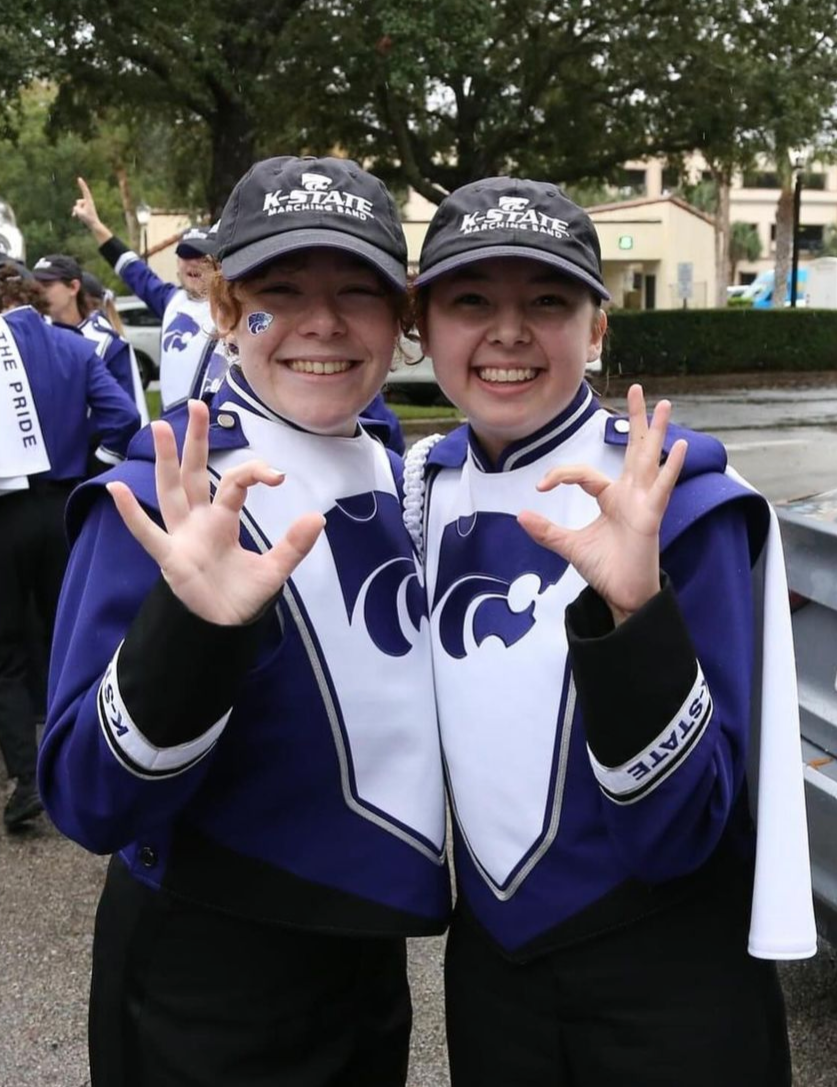 Zoe Schumacher (left) and Erin Flax (right) pose in their marching band gear before their performance. Schumacher is in search of a kidney donor. (Photo Courtesy of Zoe Schumacher)