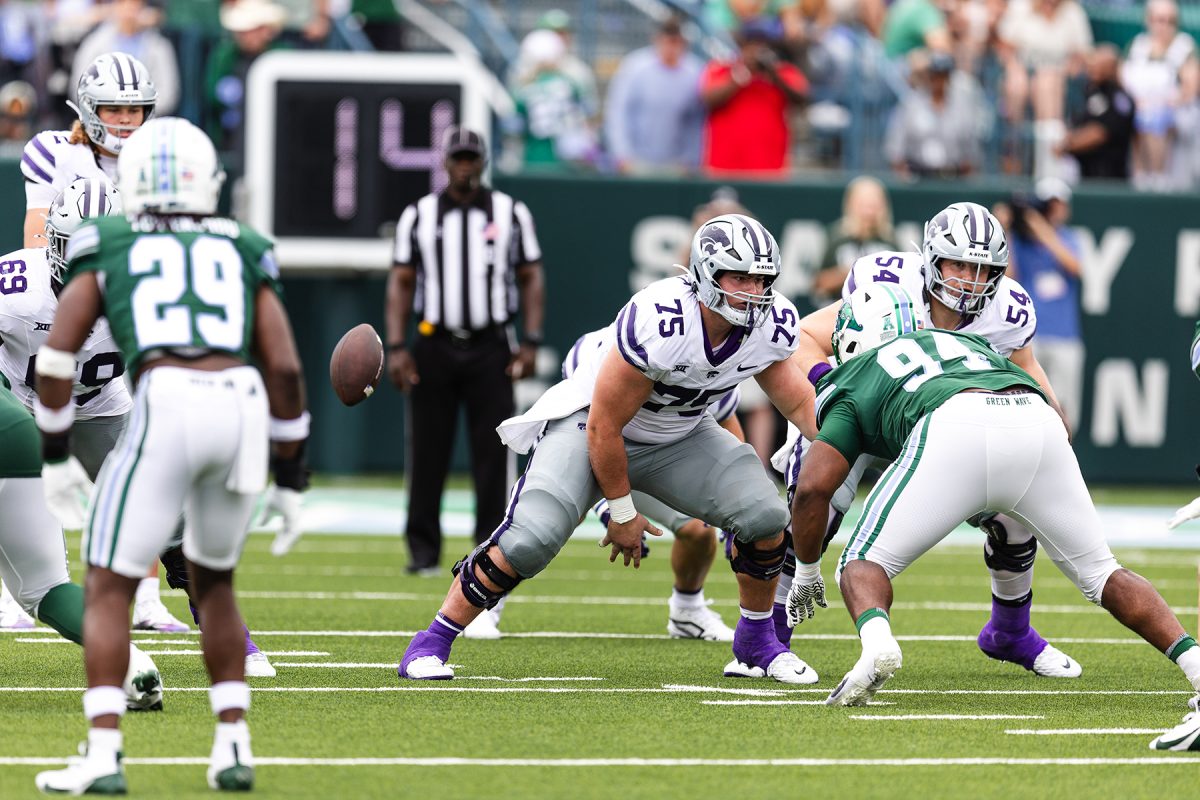 Junior Sam Hecht (75) blocks alongside teammate Hadley Panzer (54) in K-State Week 2 contest at Tulane. K-State overcame a 10-point halftime deficit to win 34-27. (Photo courtesy of K-State Athletics)