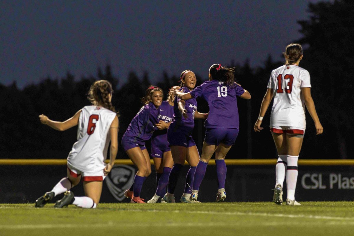 Freshman Langley Mayers celebrates with her team after junior Sophie Simmons scores for K-State. The Wildcats fell to Utah 1-2 on Oct. 10 at Buser Family Park. 