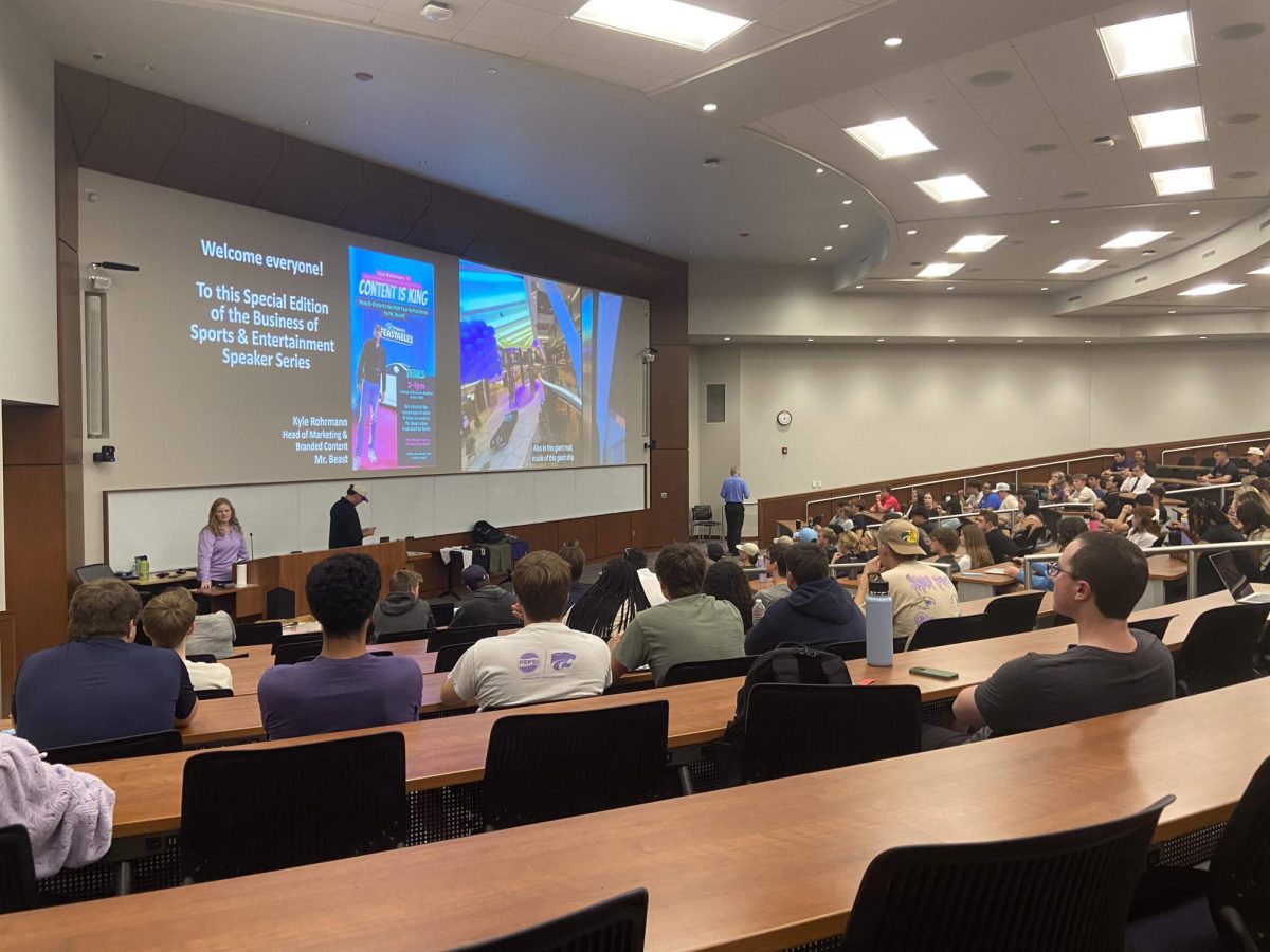 Kyle Rohrmann presents to K-State students in the Business Building. 