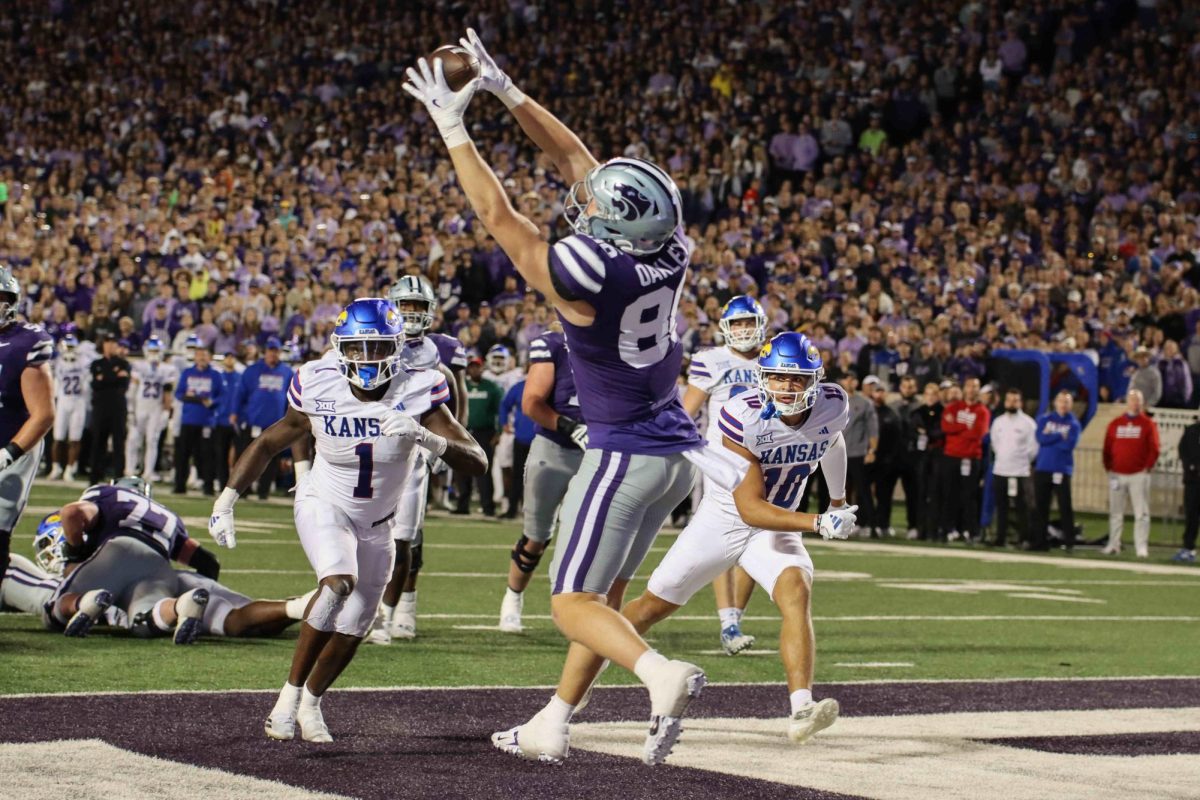 Tight end Garrett Oakley hauls in a touchdown against Kansas in a 29-27 Sunflower Showdown win. K-State won its 16th straight game against Kansas on Oct. 26