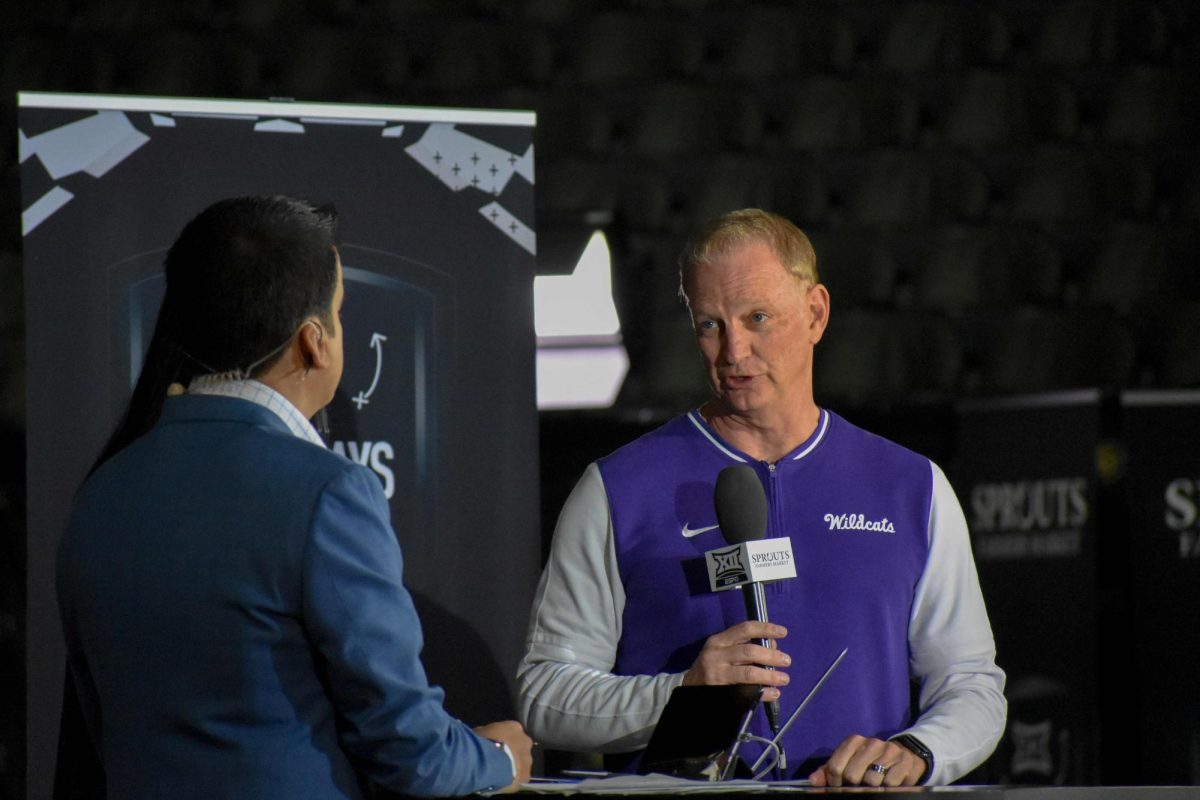 Head coach Je Mittie speaks with an ESPN reporter at Big 12 Media Days on Oct. 22 at T-Mobile Center in Kansas City, Mo. K-State was selected as conference preseason No. 1 for the first time in program history.