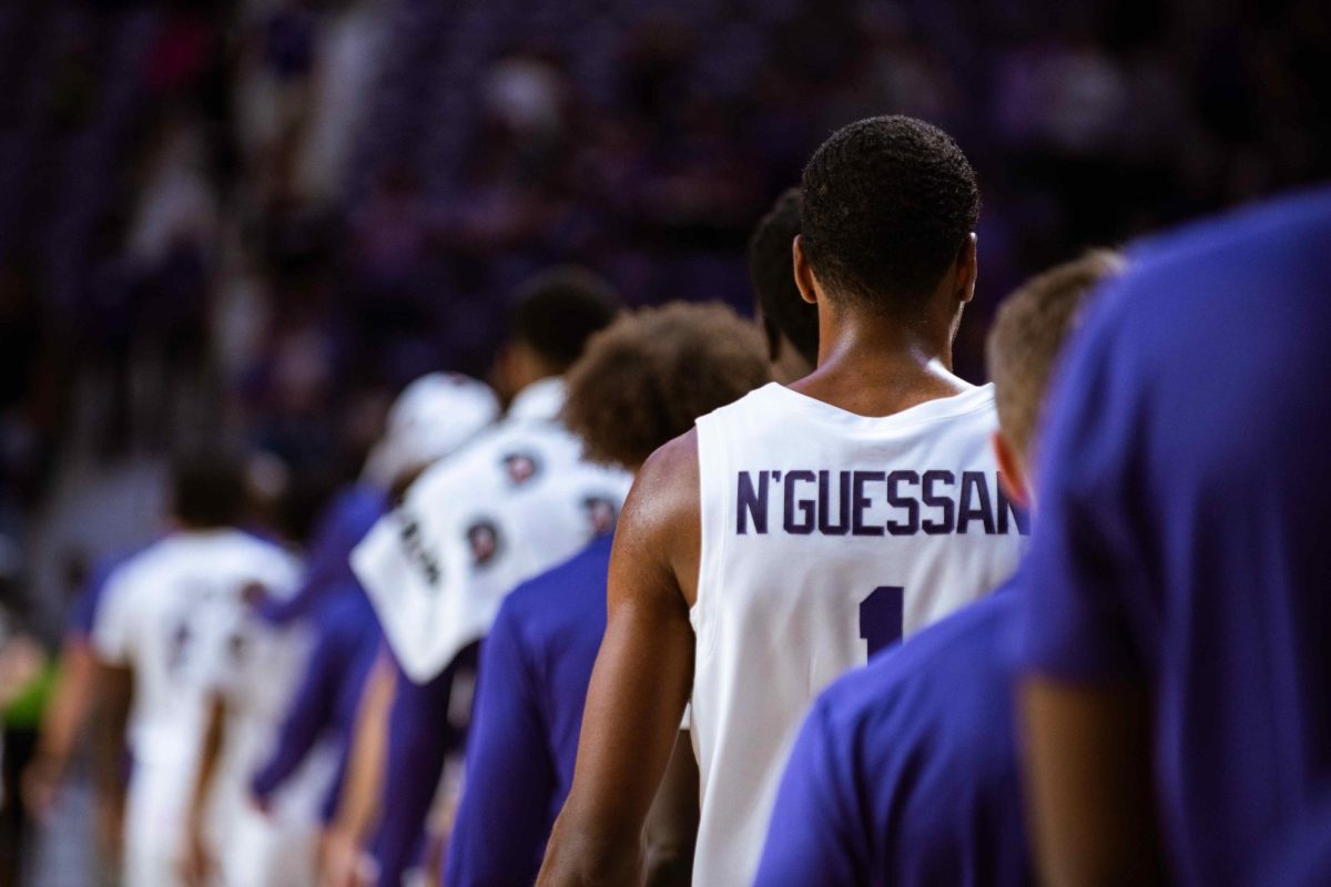 Wing David N'Guessan walks in line with teammates at K-State's exhibition win over Fort Hays State. During the season opener on Nov. 5, N'Guessan recorded a double-double.