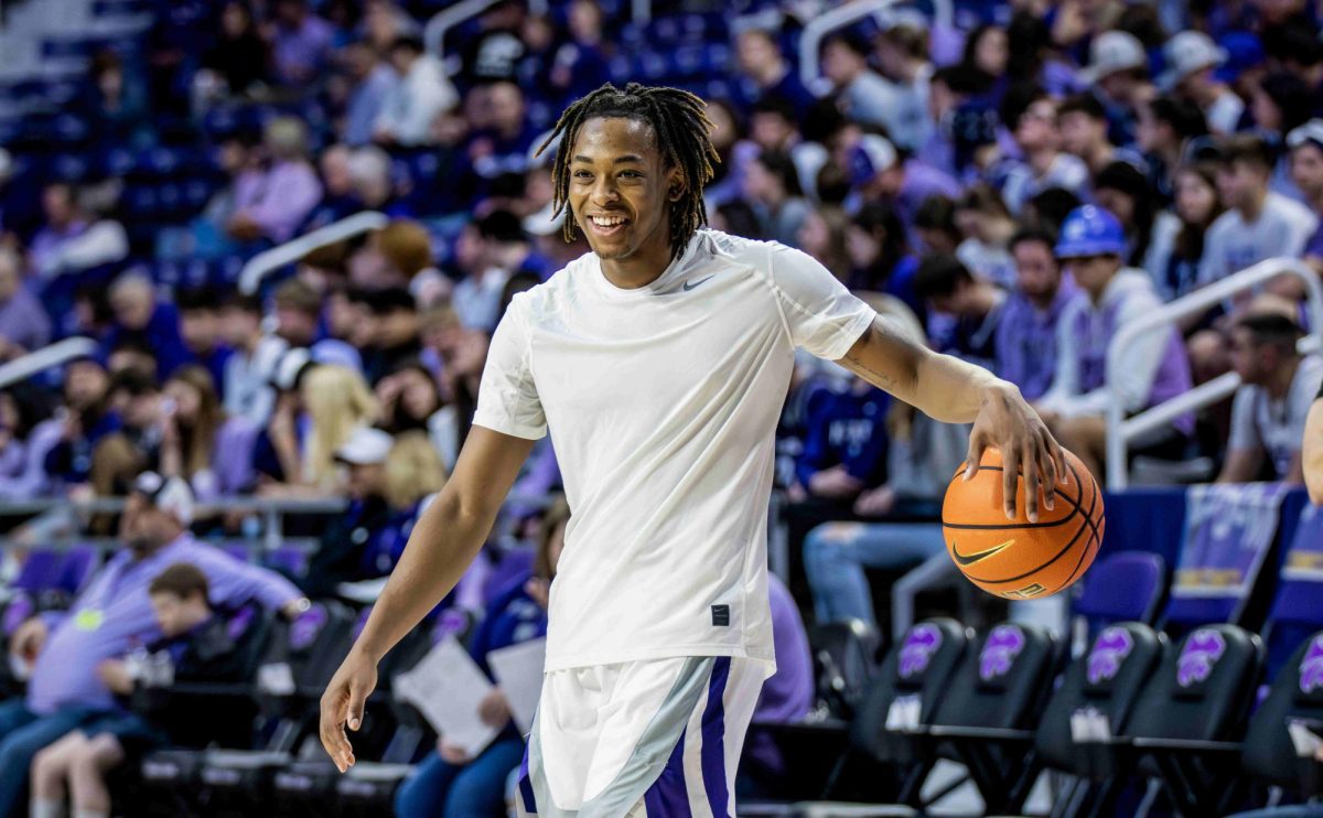 Guard RJ Jones laughs with a teammate as the Wildcats prepare to play Oklahoma on Jan. 30. Jones transferred to TCU after the season and will host K-State in a reunion in Fort Worth on Jan. 4, 2025.