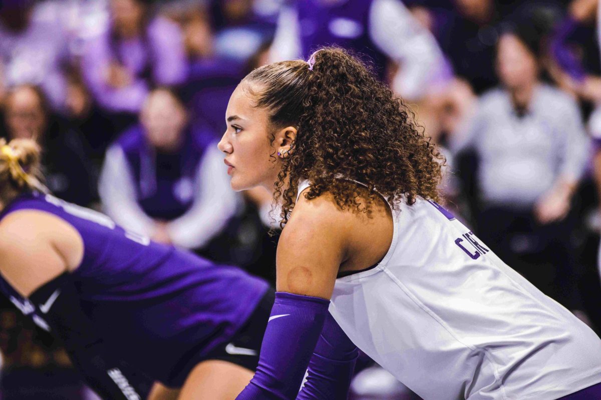 Aliyah Carter gets into a defensive position in preparation for serve receive. The Wildcats fell to the Sooners 0-3 on Sept. 22 at Morgan Family Arena.