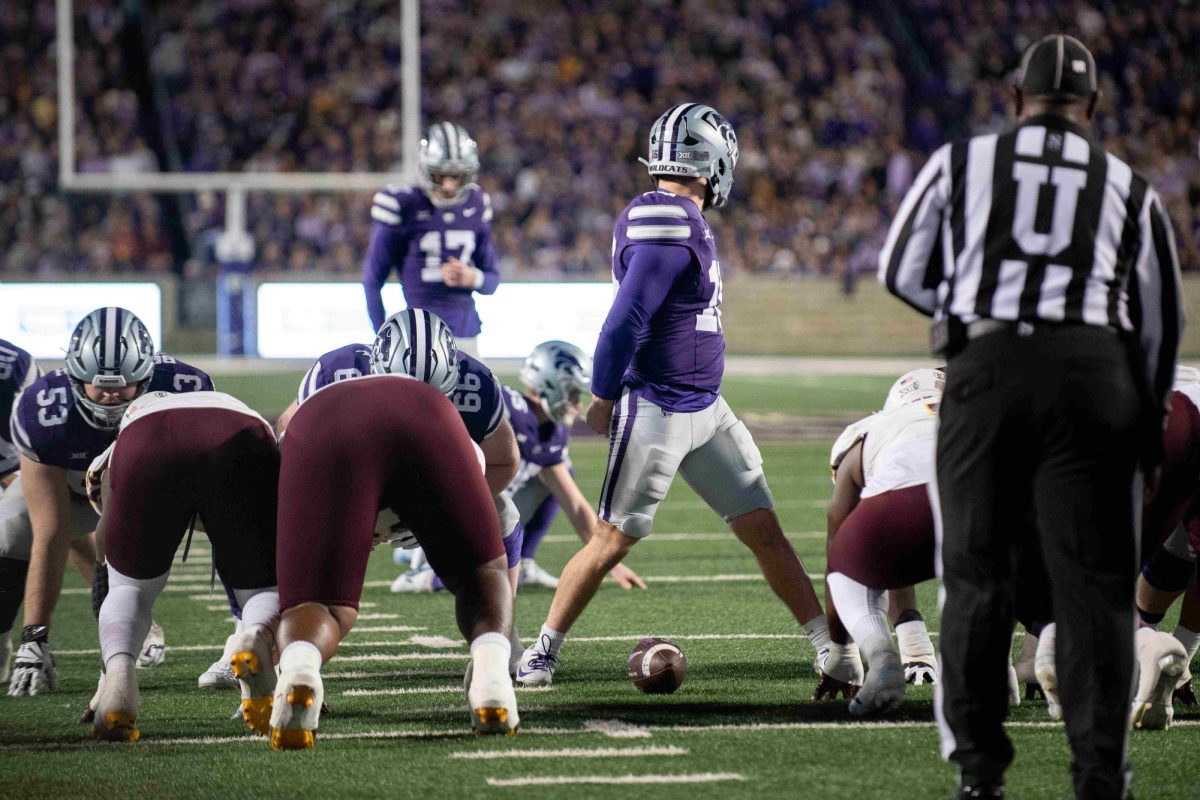 Long Snapper Mason Olguin (16) looks back to placeholder Simon McClannan (35). An errant snap would result in a turnover on downs for the Wildcats as they continued to struggle with special teams against Arizona State.