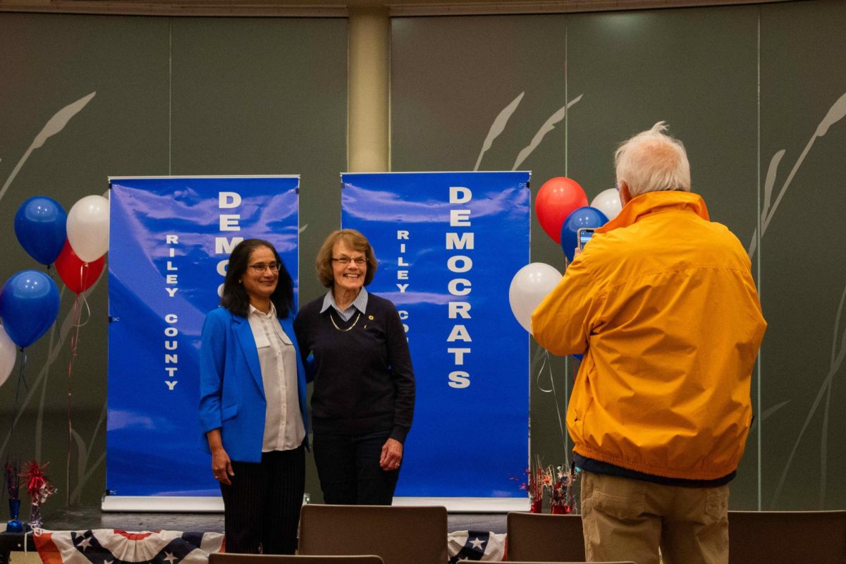 Usha Reddi (left) poses for a picture with supporters at her watch party. Reddi lost the election for Kansas Senate District 22 to Brad Starnes.