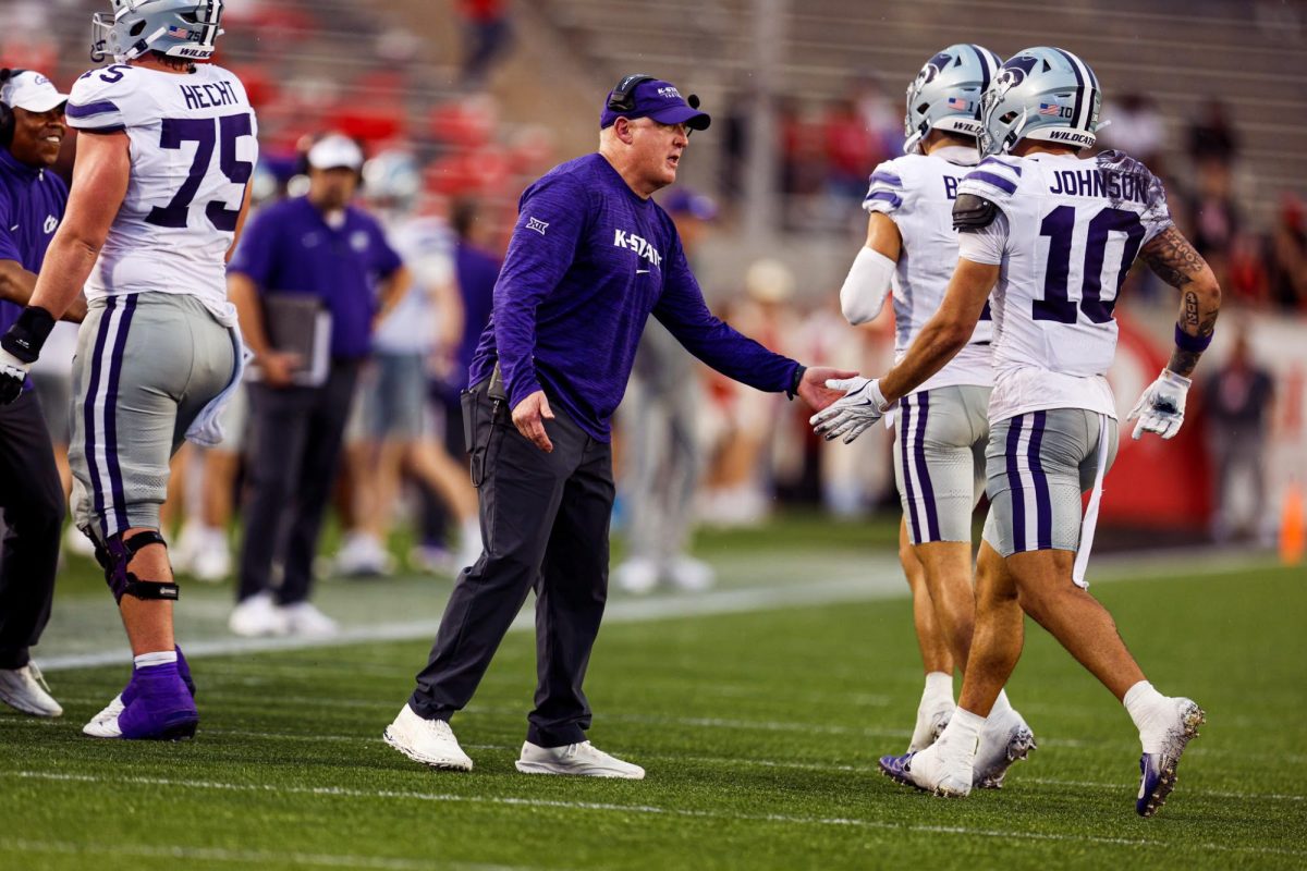 Head coach Chris Klieman claps players as they head to the sideline at Houston on Nov. 2. No. 17 K-State lost 24-19. (Photo courtesy of K-State Athletics)