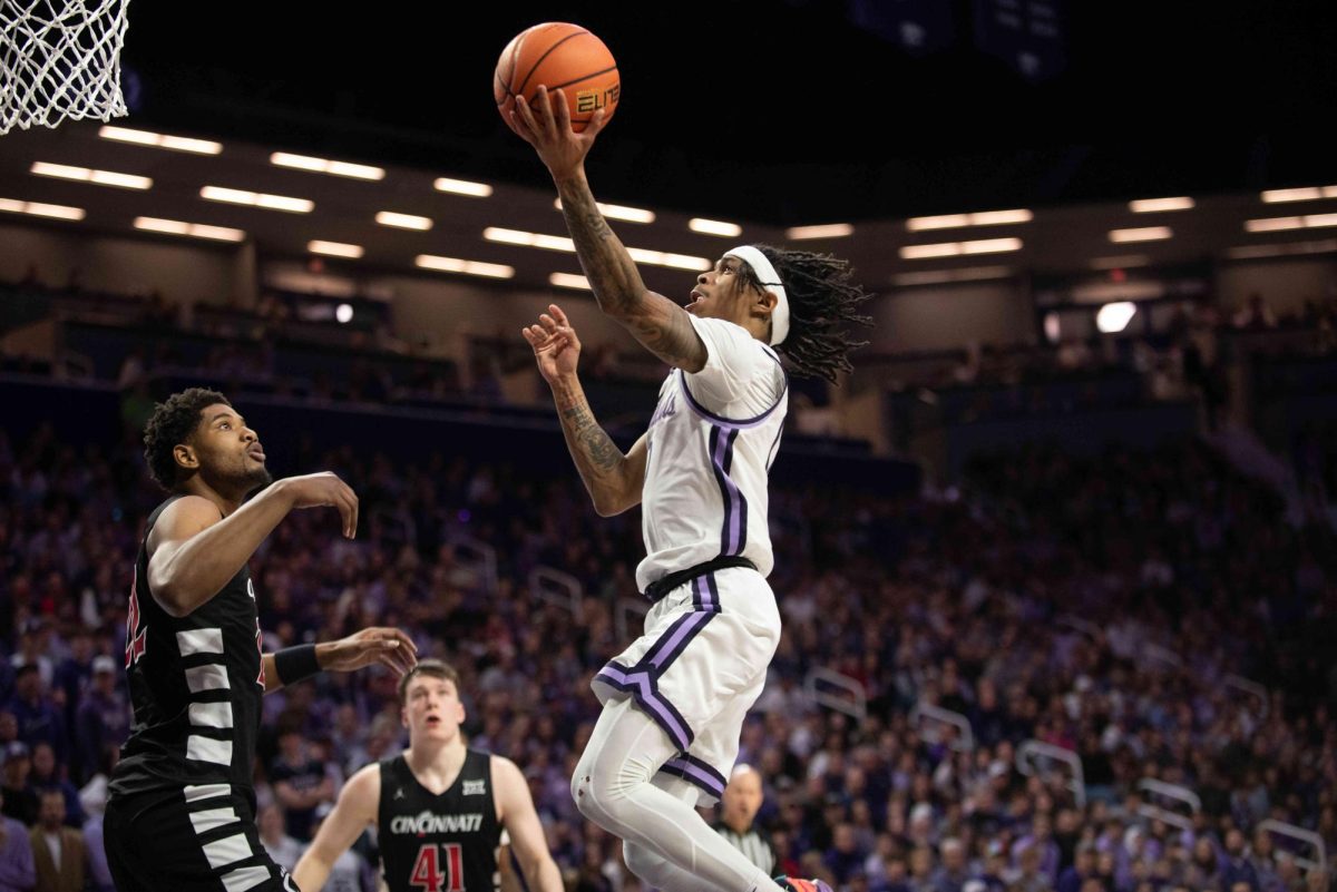 K-State guard Dug McDaniel charges to the hoop for a basket in the Wildcats' home upset of No. 16 Cincinnati on Dec. 30. McDaniel notched his second start of the year.