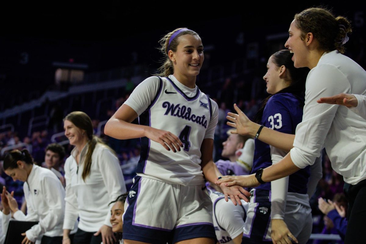 K-State guard Serena Sundell low-fives teammates as she heads to the sideline during K-State's 110-24 win over USC Upstate on Dec. 5. The Wildcats set the program record for largest win margin.