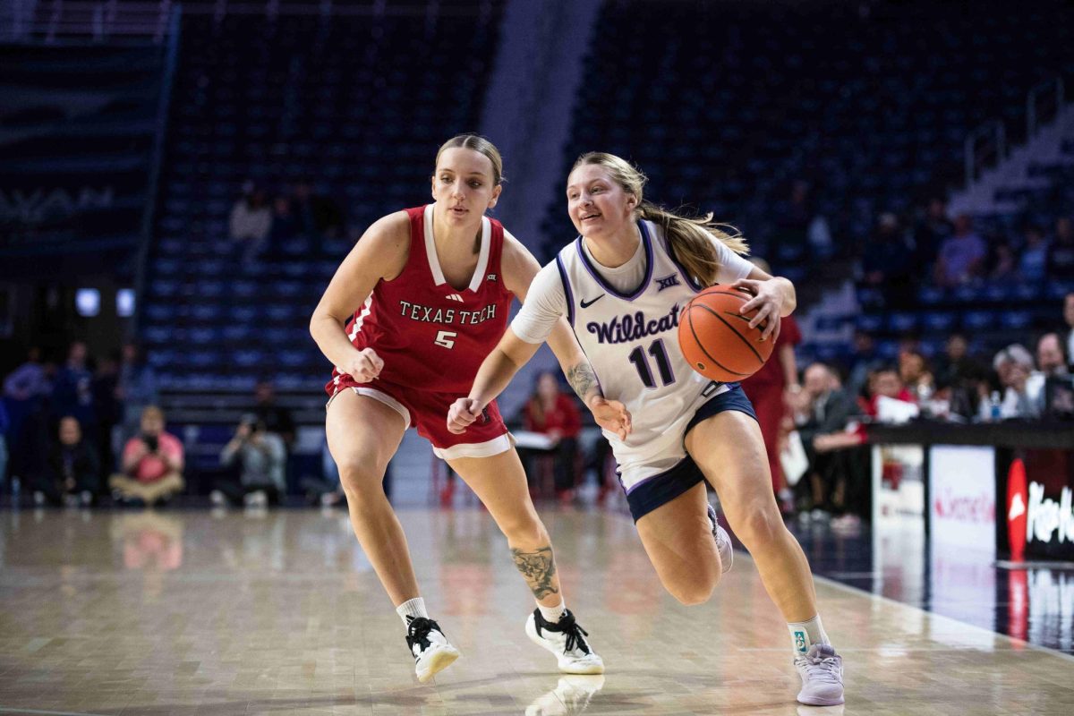 Kansas State guard Taryn Sides dribbles down the court at Bramlage with a smile during K-State's 20-point Big 12 win on Jan. 4 against Texas Tech.