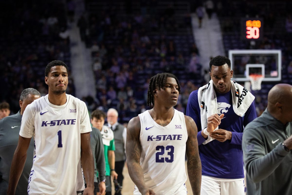 From left-to-right, David N'Guessan, Macaleab Rich and Ugonna Onyenso exit the court following the first half against Arkansas-Pine Bluff.